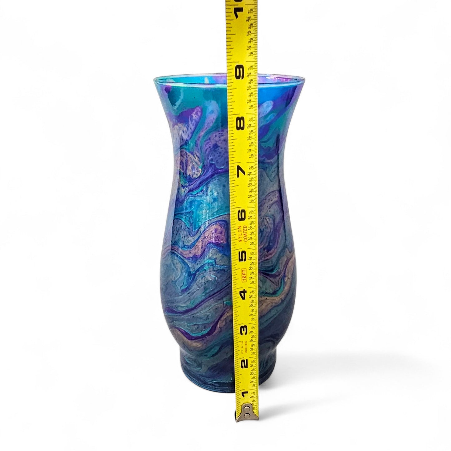This abstract, peacock feather painted glass vase is the perfect accent piece for any décor.