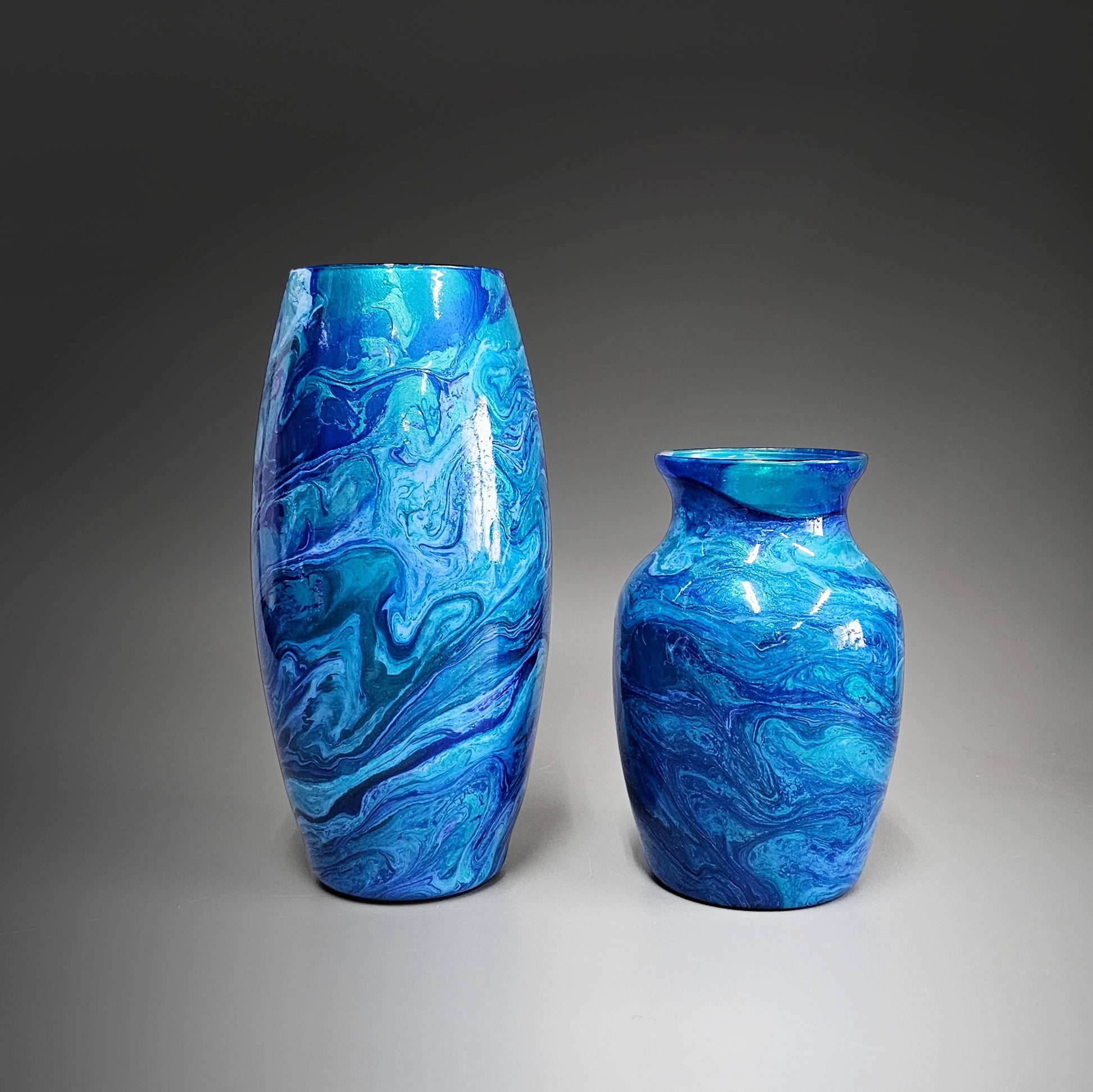 Flowers don't last; hand painted vases do. Either one of these abstract, glass flower vases makes the perfect accent piece for any décor. Unique 