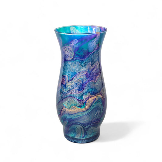 This abstract, peacock feather painted glass vase is the perfect accent piece for any décor.