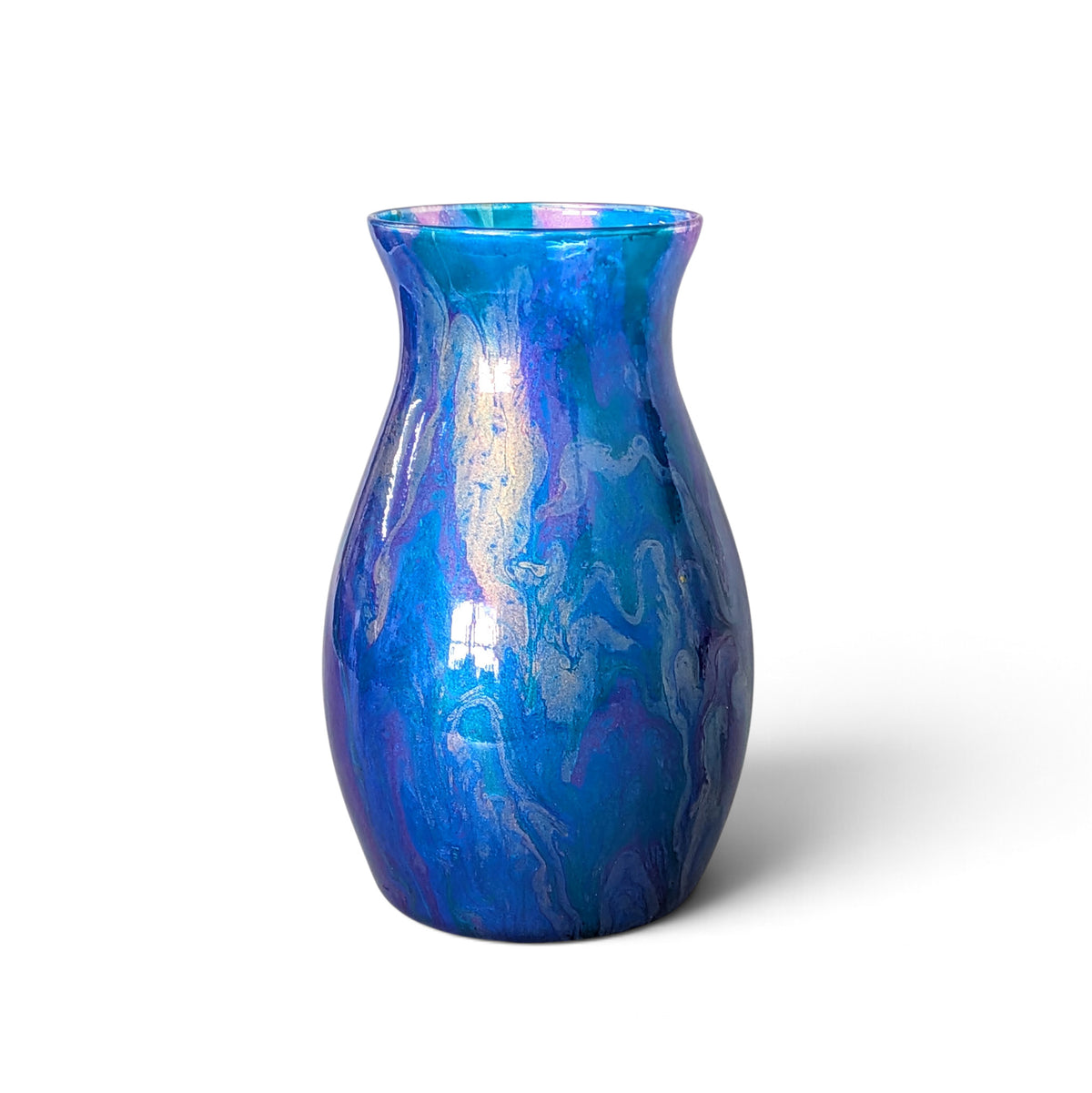 A glossy ceramic vase with a flared rim, featuring a marbled blue and purple glaze with iridescent white highlights, set against a plain white background.